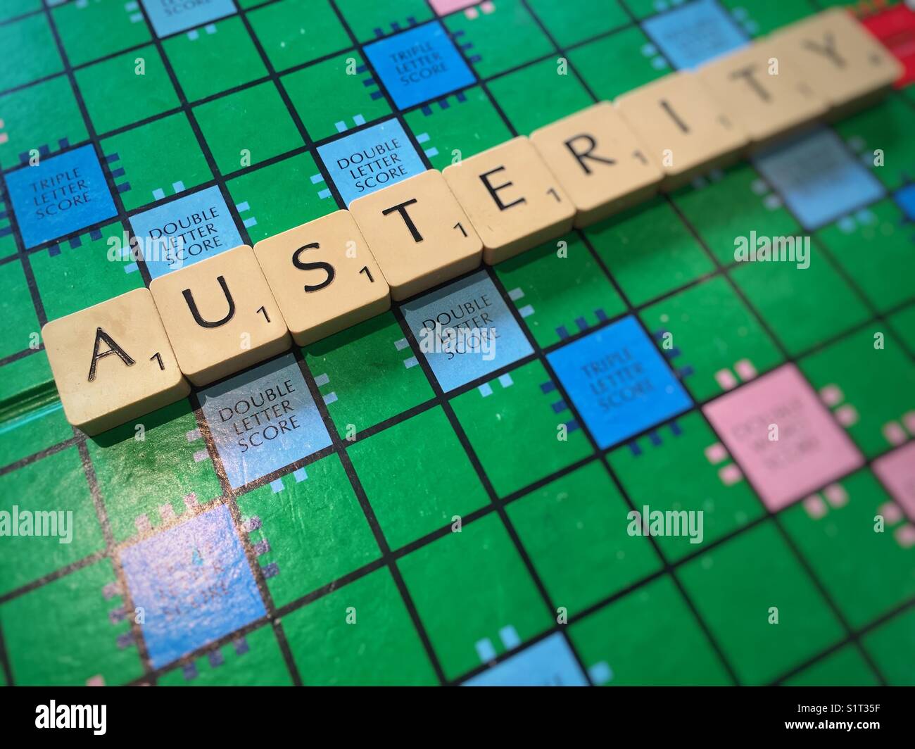 The word Austerity written with scrabble tiles - Smartphone Captured Stock Image