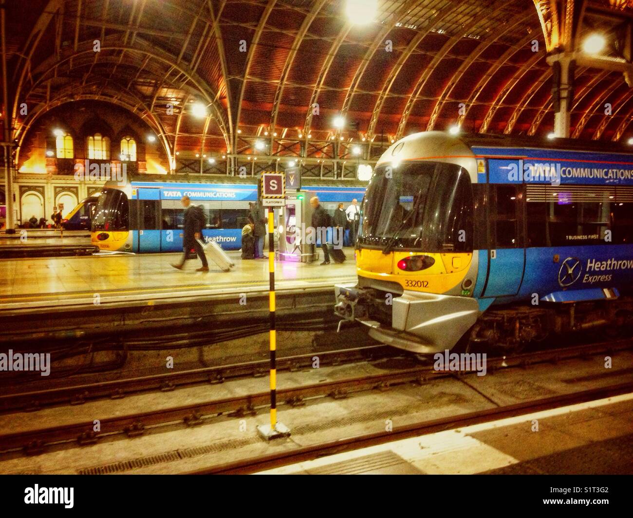 Heathrow Express trains wait at their platforms in Paddington Railway Station. - Smartphone Captured Stock Image