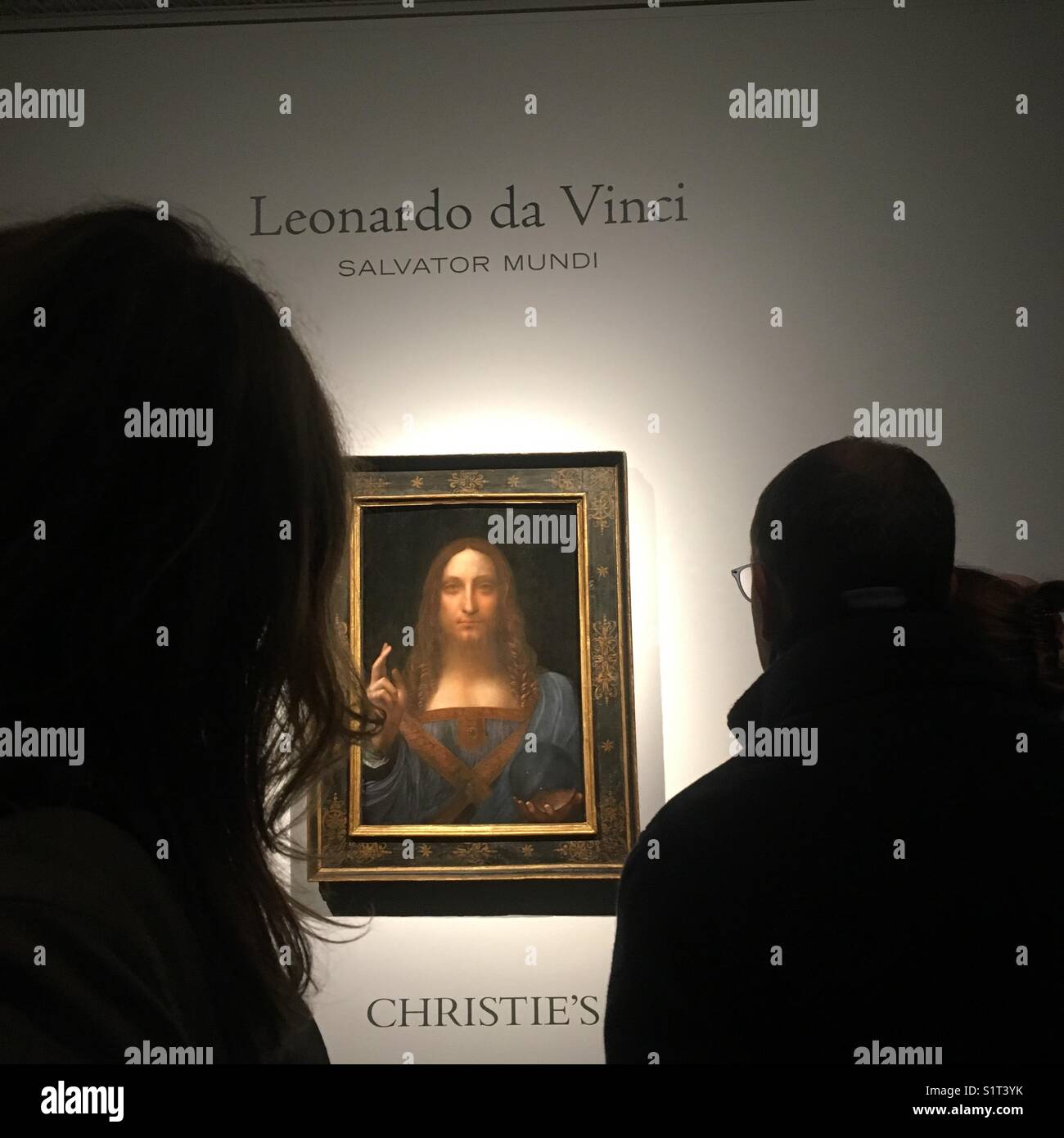 Salvator Mundi hanging in Christie’s before it’s record breaking auction - Smartphone Captured Stock Image