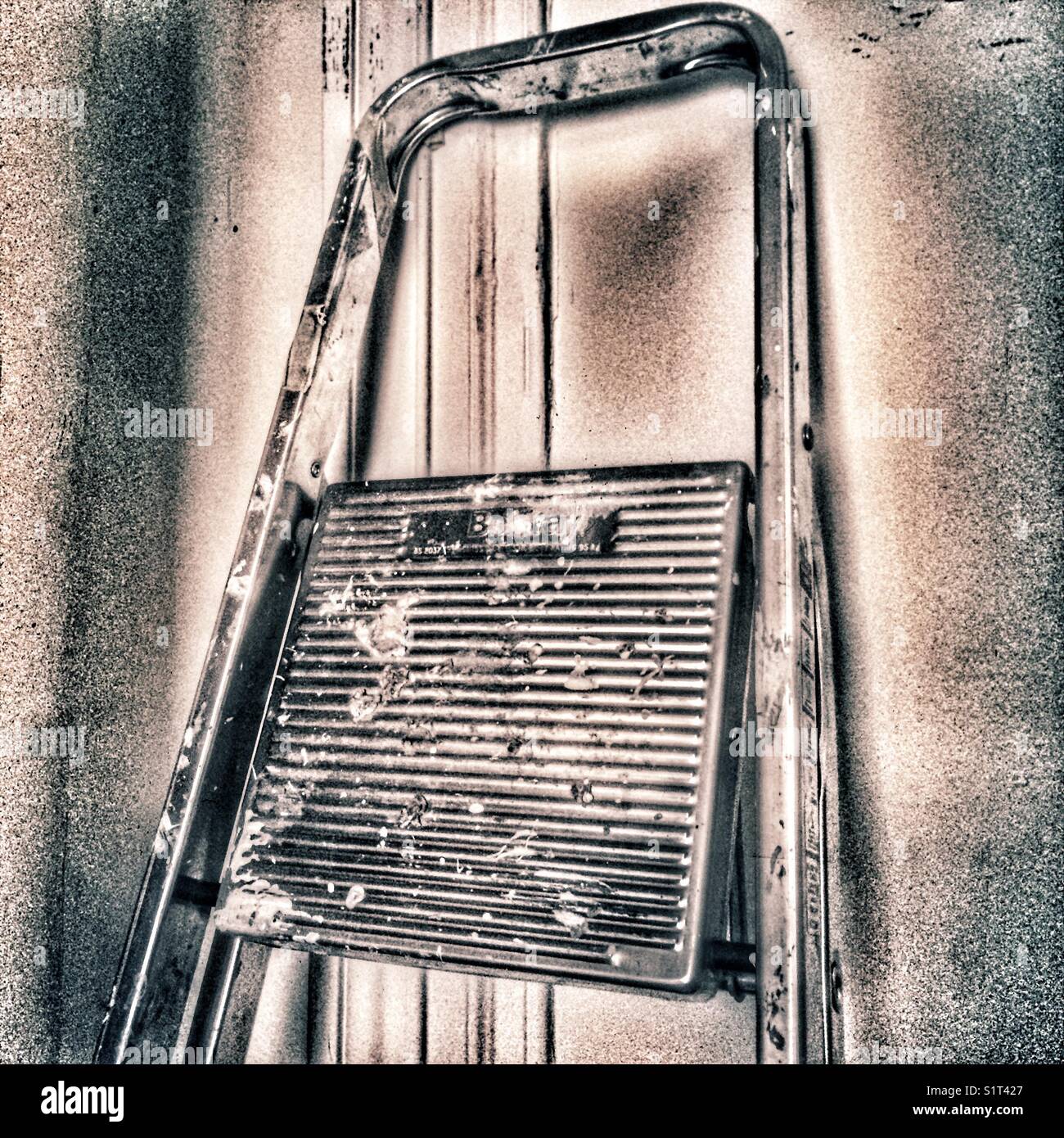 Stepladders propped against wall - Smartphone Captured Stock Image