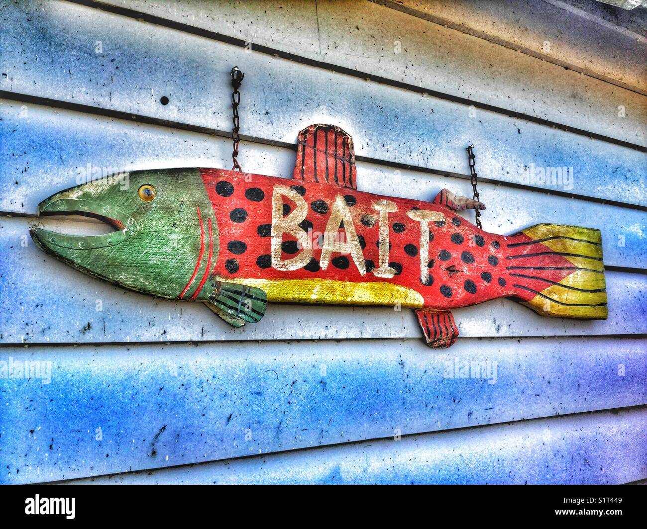 Wooden bait sign on the exterior of a fishing shop Stock Photo - Alamy