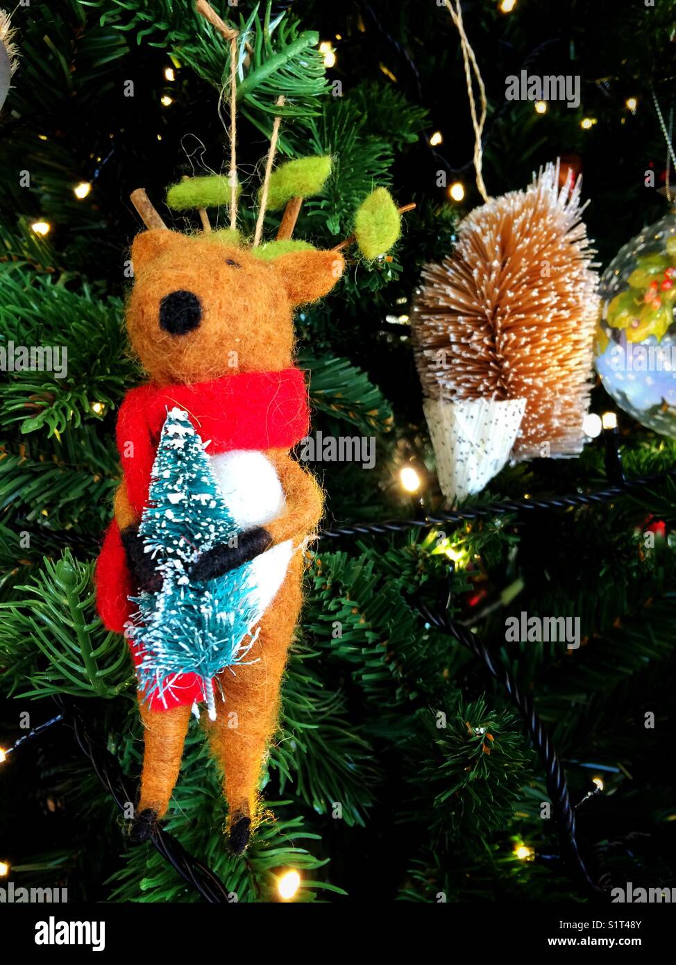 Christmas mouse decoration hanging on a Christmas tree - Smartphone Captured Stock Image