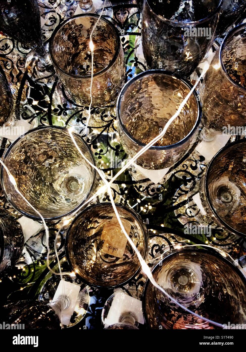 Silver & gold Christmas glasses with Christmas lights - Smartphone Captured Stock Image