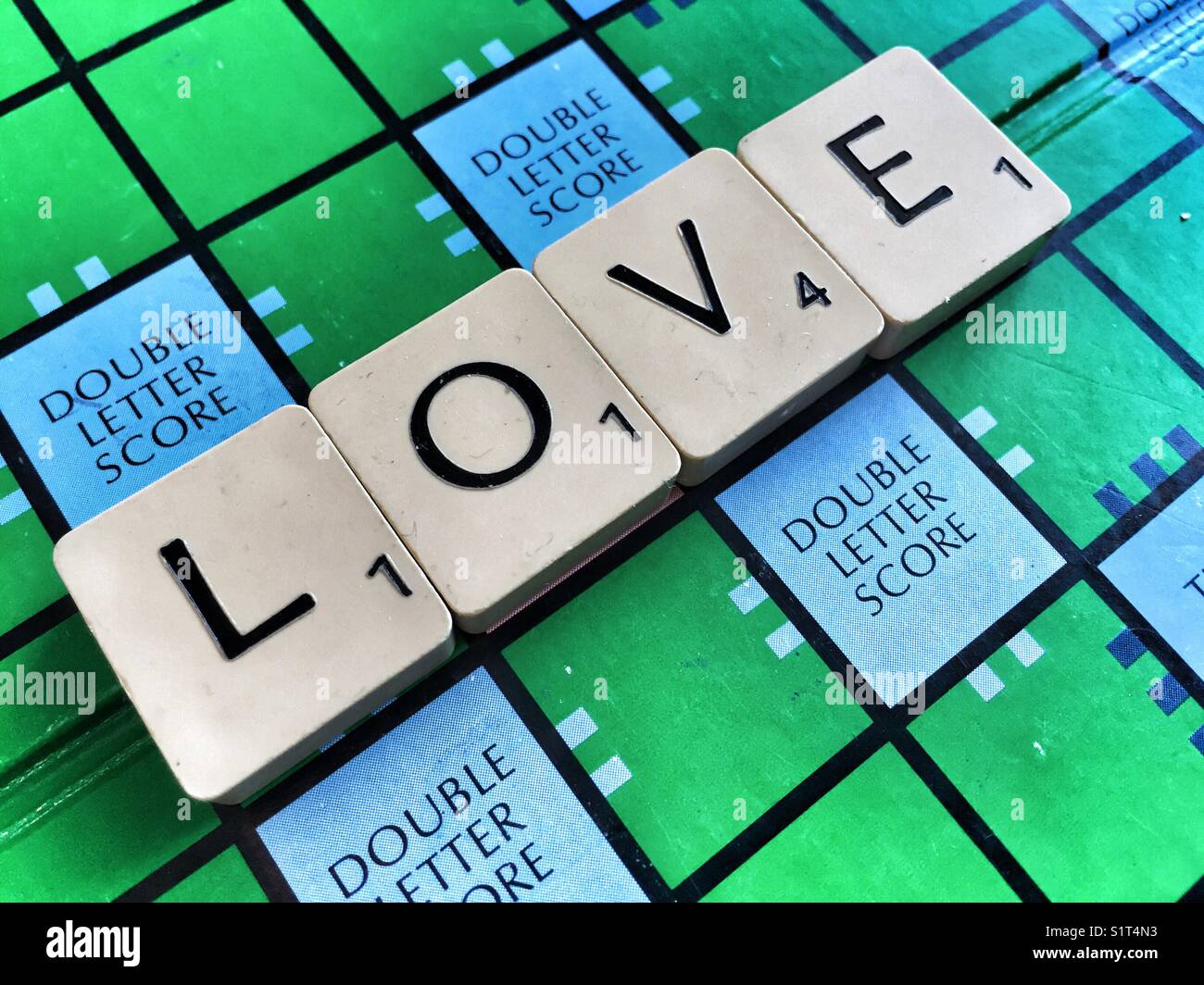 The word Love written with Scrabble tiles - Smartphone Captured Stock Image