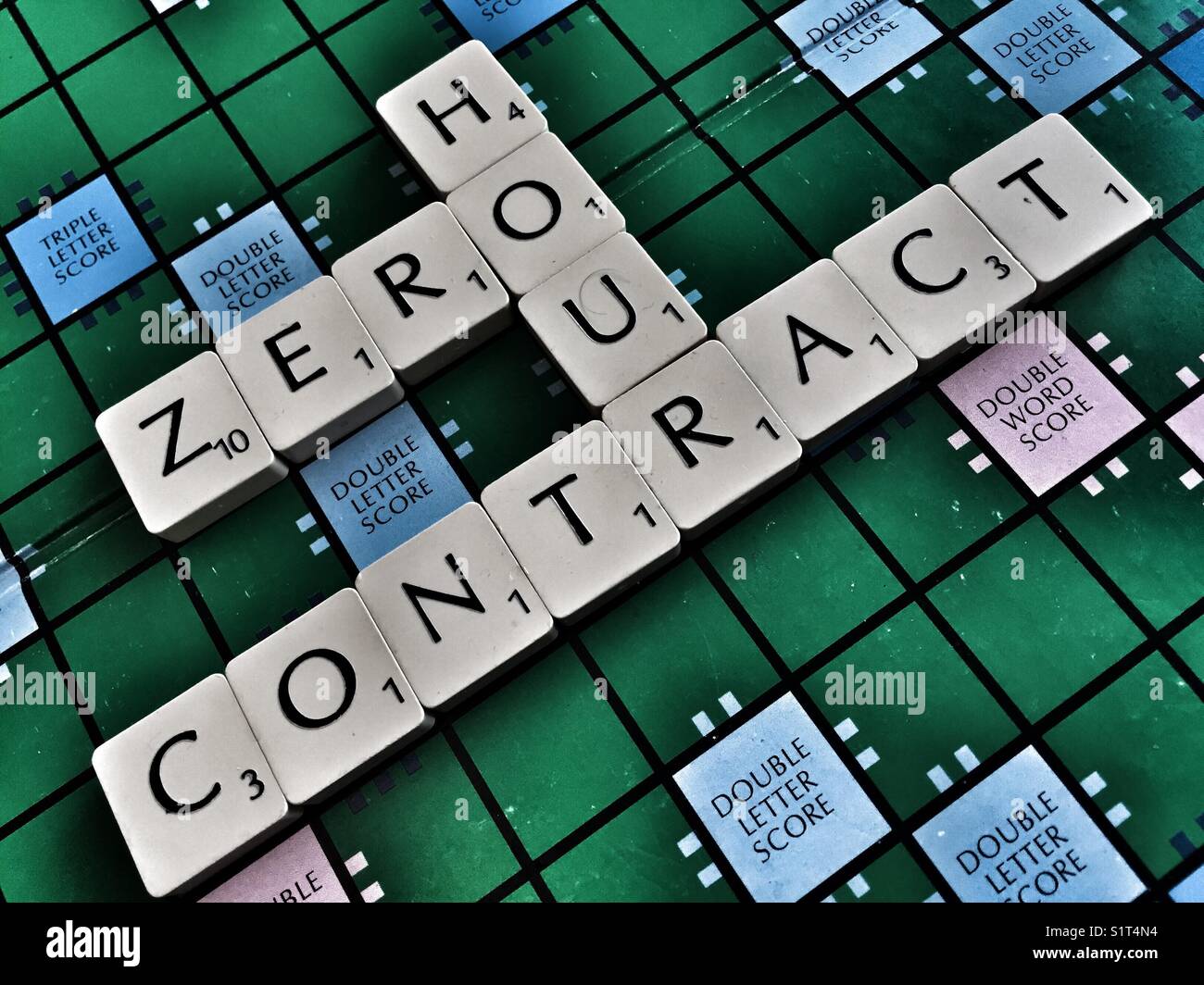 The words: Zero hour contact written with scrabble tiles - Smartphone Captured Stock Image