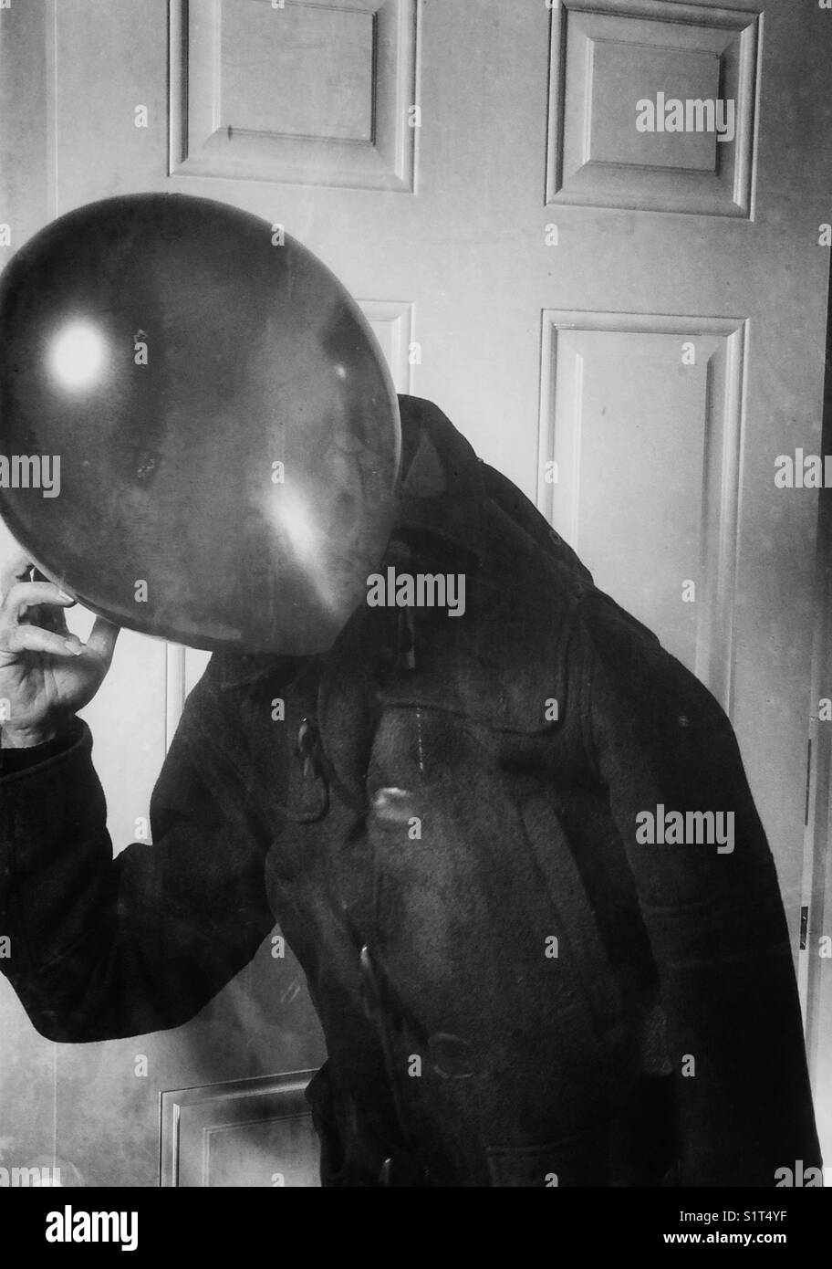 Thinking Mr blue/balloon walking into the room - Smartphone Captured Stock Image