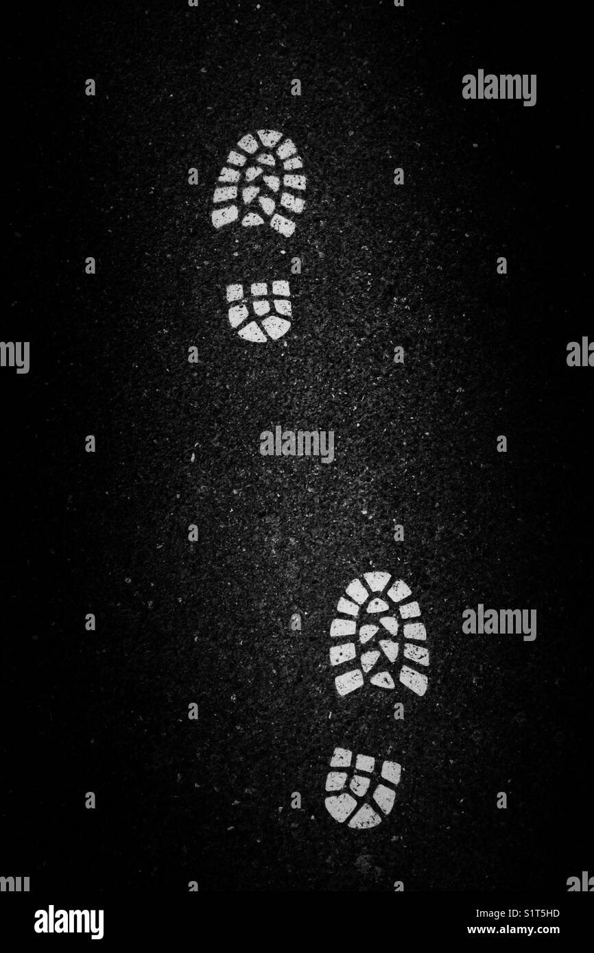 Boot prints on asphalt - Smartphone Captured Stock Image