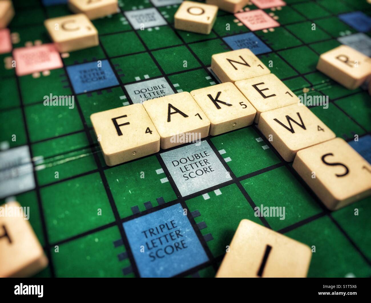 Fake news written with scrabble tiles - Smartphone Captured Stock Image
