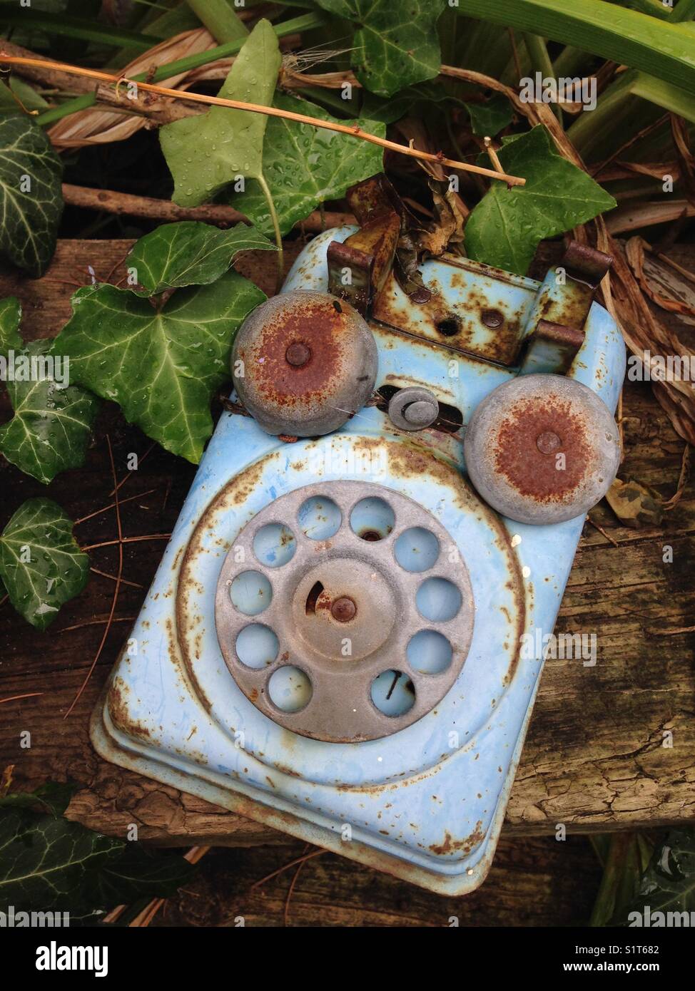 An old toy telephone left outside - Smartphone Captured Stock Image