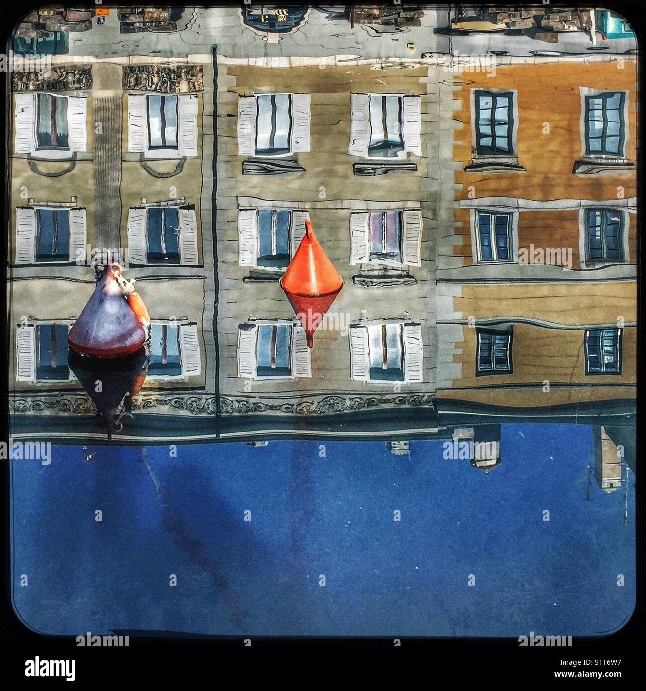 Reflections of houses in the water - Canal Grande, Trieste, Italy Stock Photo