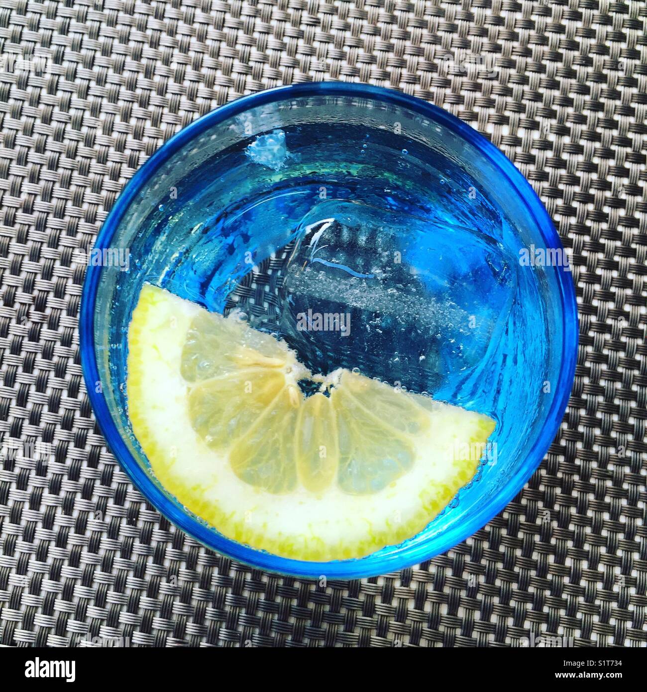Lemon in glass of water - Smartphone Captured Stock Image