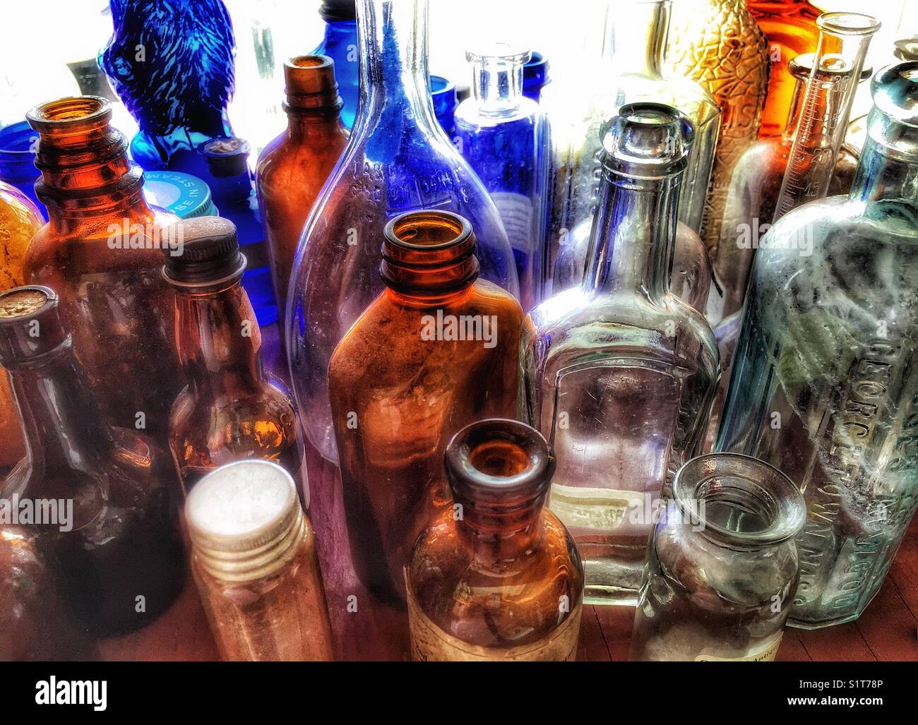 Old bottles in thrift store window - Smartphone Captured Stock Image
