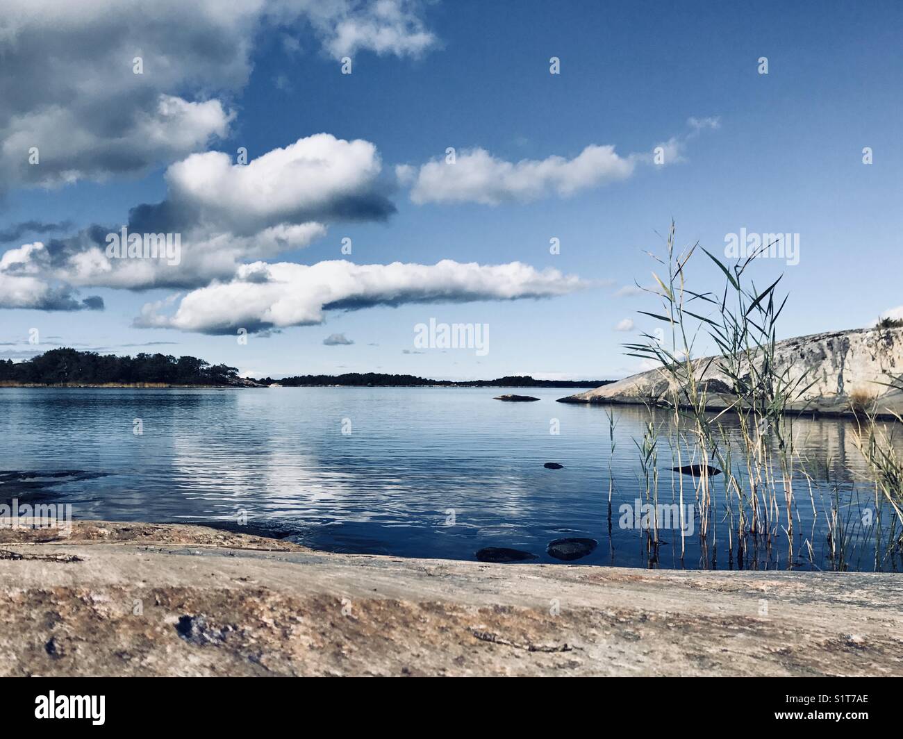 Beutiful still water and dramatic cloudy sky Stock Photo Alamy