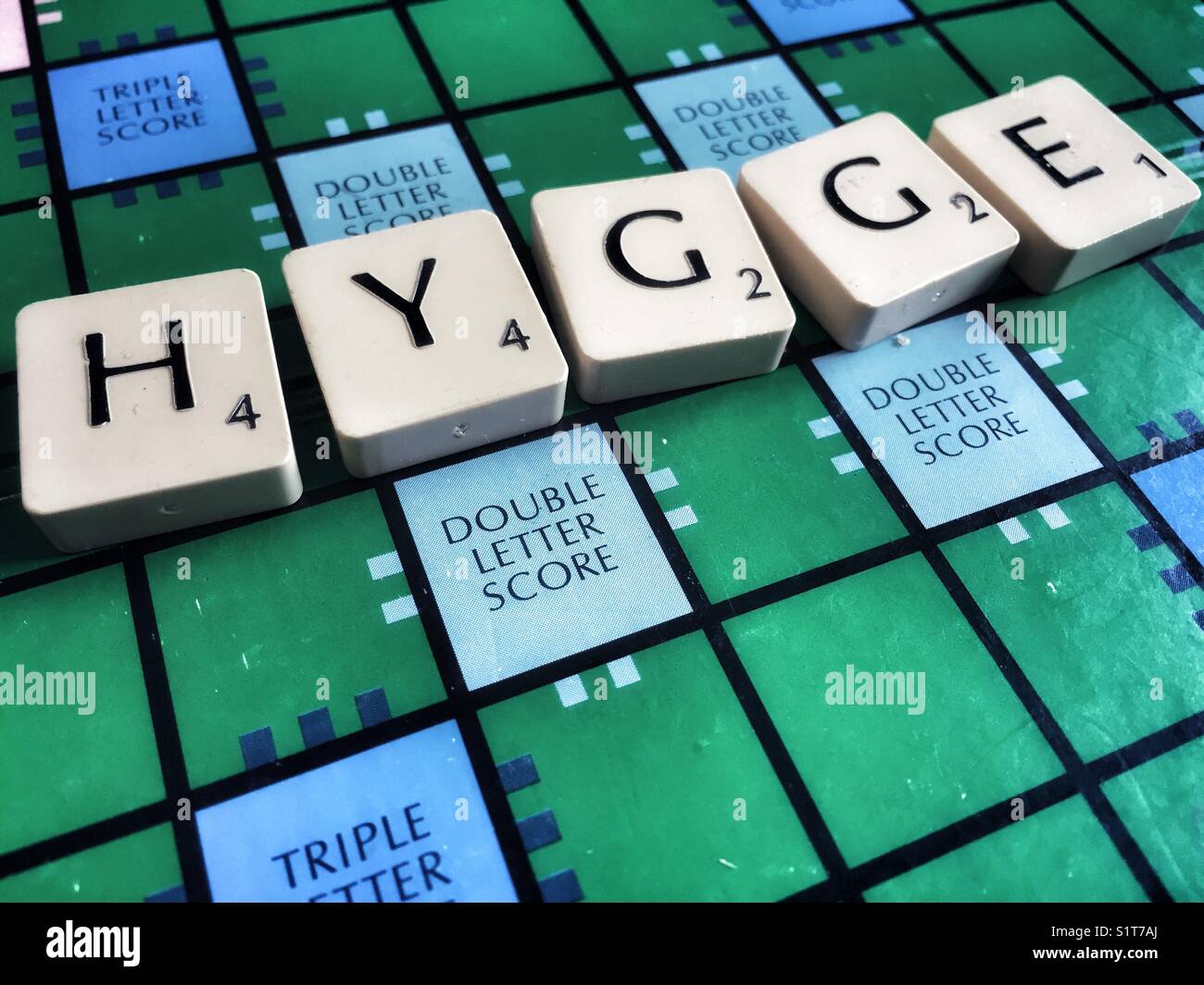 The Danish word hygge written on a scrabble board Stock Photo Alamy