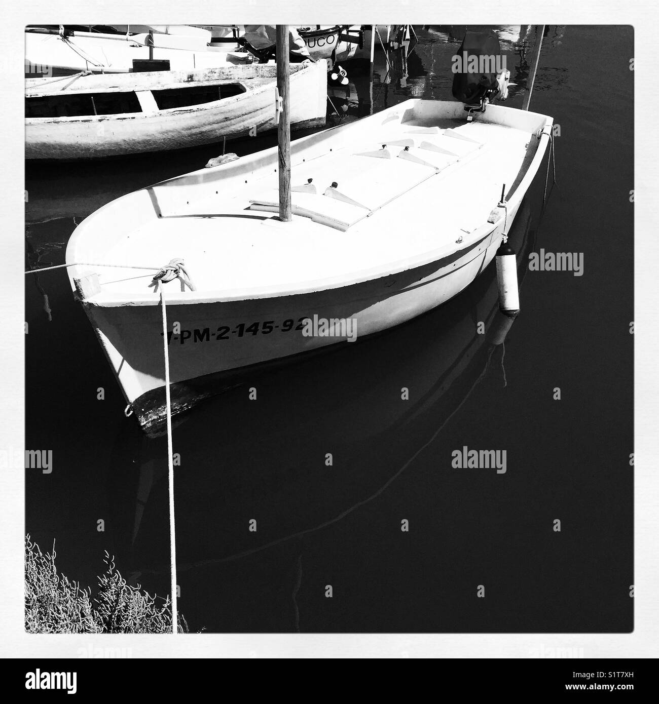 Fishing boat on mirror water Stock Photo