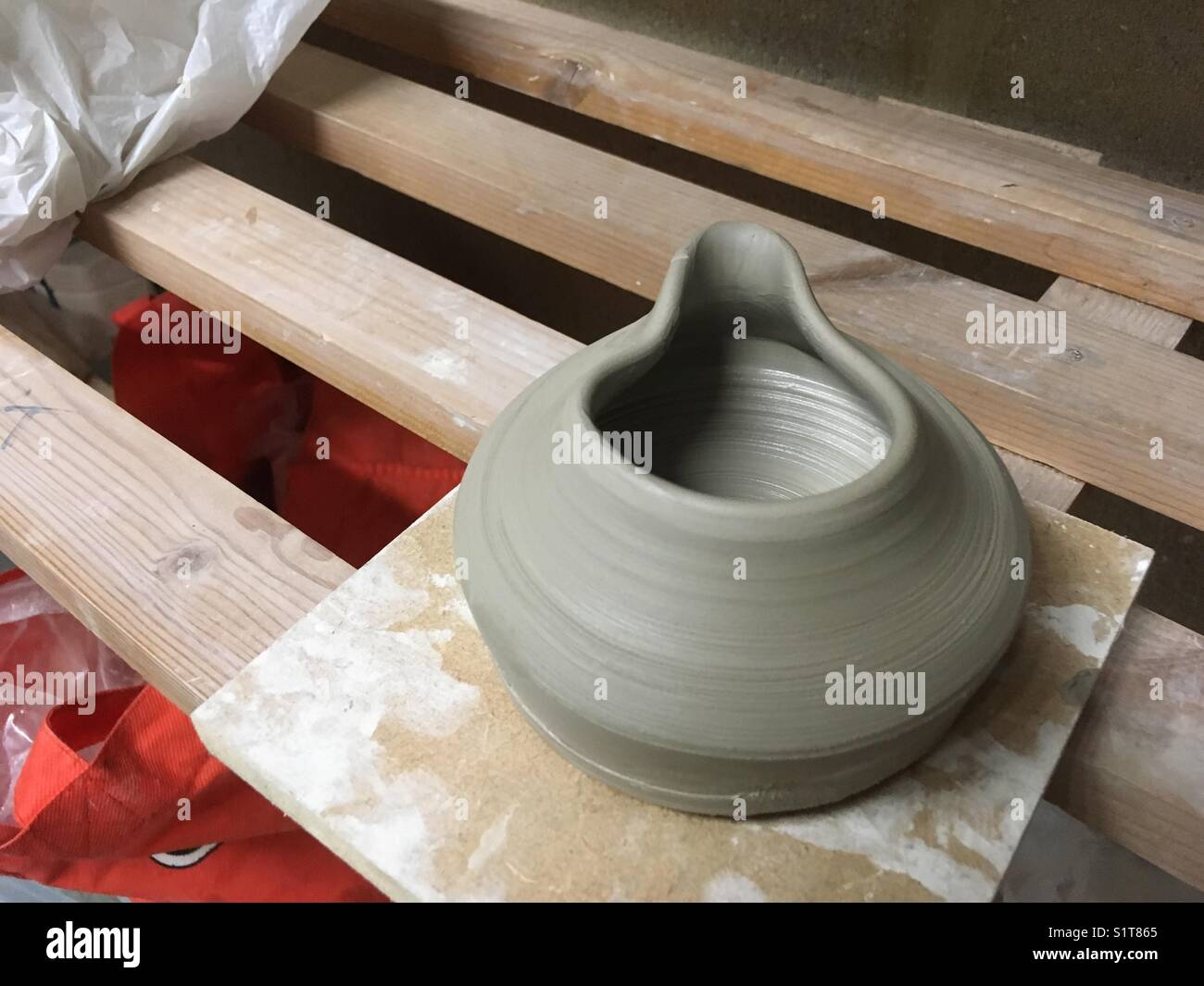 Throwing a jug on the potters wheel. - Smartphone Captured Stock Image