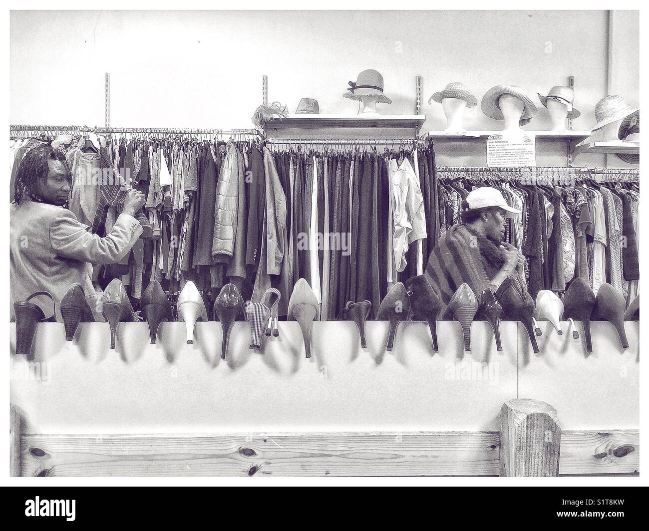 Shoppers in a local charity shop. - Smartphone Captured Stock Image