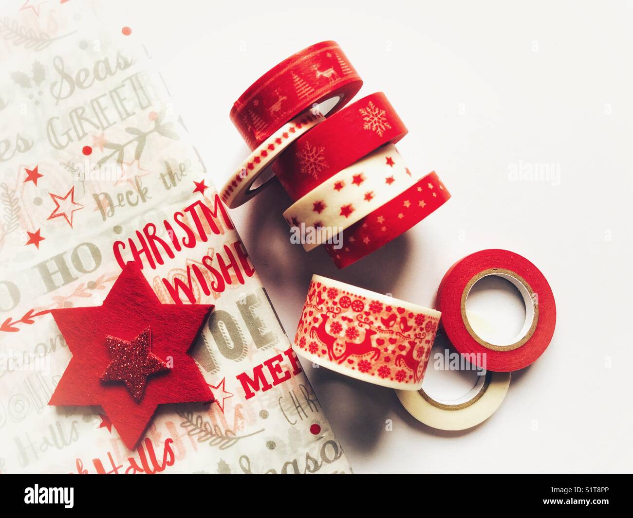 Christmas wrapping paper and rolls of festive tape - Smartphone Captured Stock Image