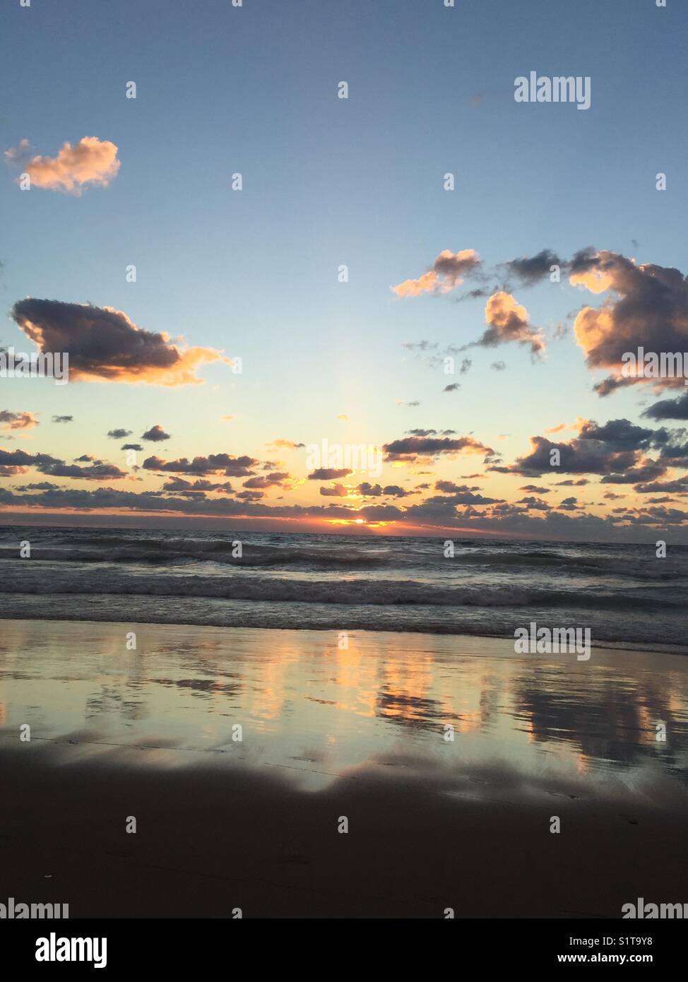 Sea mddil east , haz , sun , sunset,shadow, cloud, wave,bleu,orange, sand Stock Photo