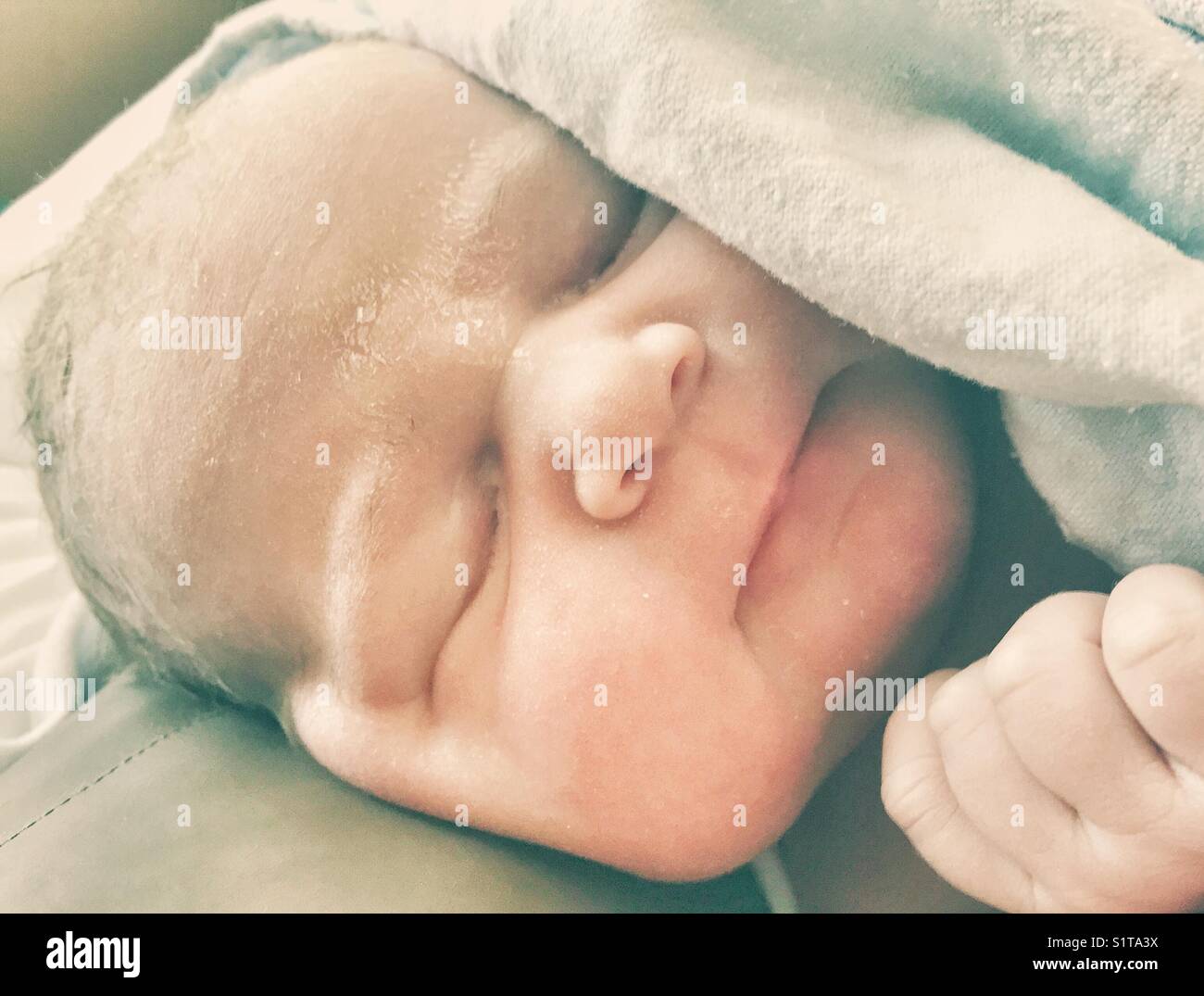 Newborn baby after birth in hospital Stock Photo