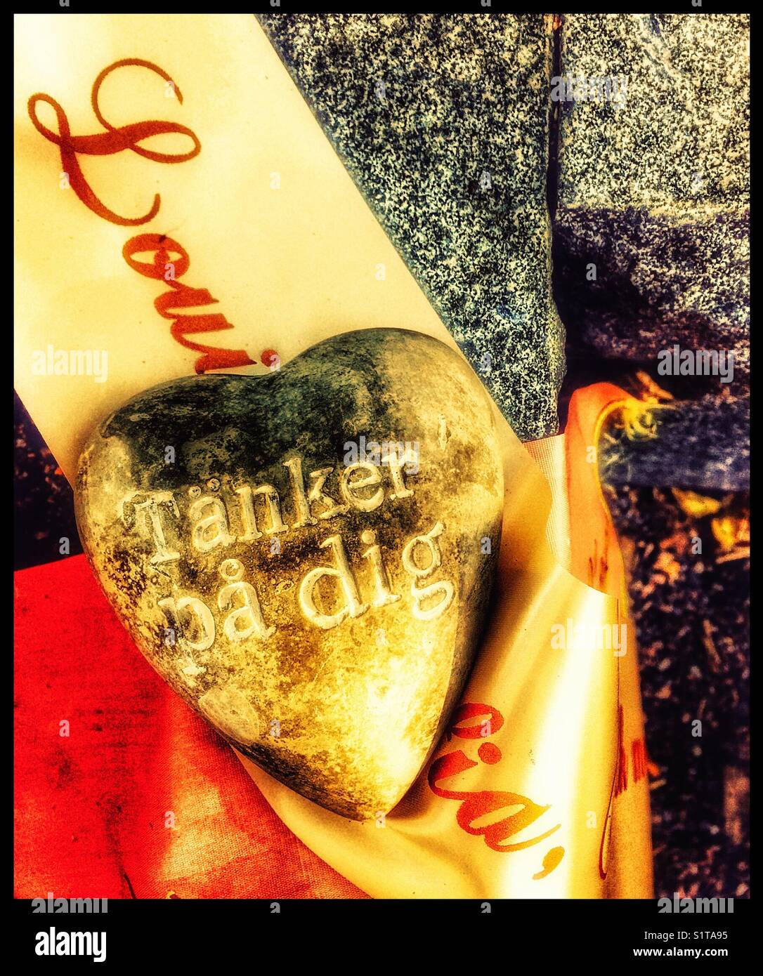 Heart shaped message on grave in Swedish “thinking of you”, Sweden, Scandinavia - Smartphone Captured Stock Image
