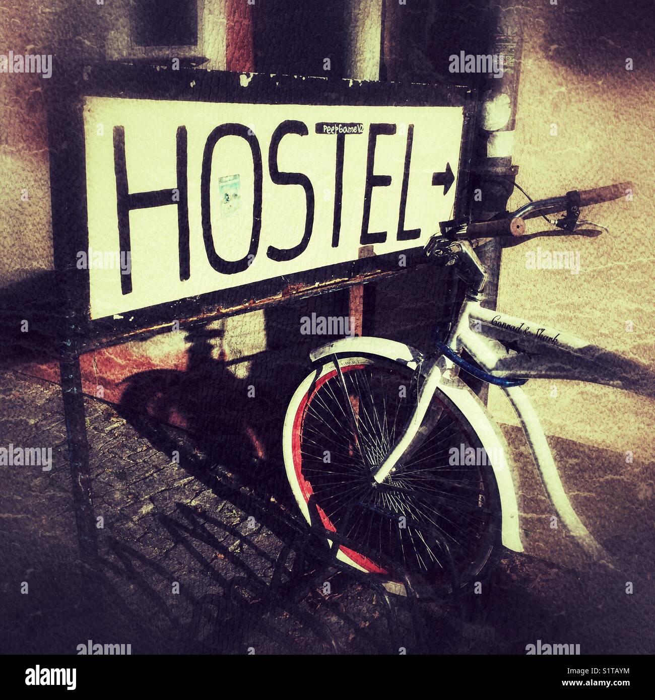 Inscription Hostel on board and parked bicycle, Ceske Budejovice,Czech Republic - Smartphone Captured Stock Image