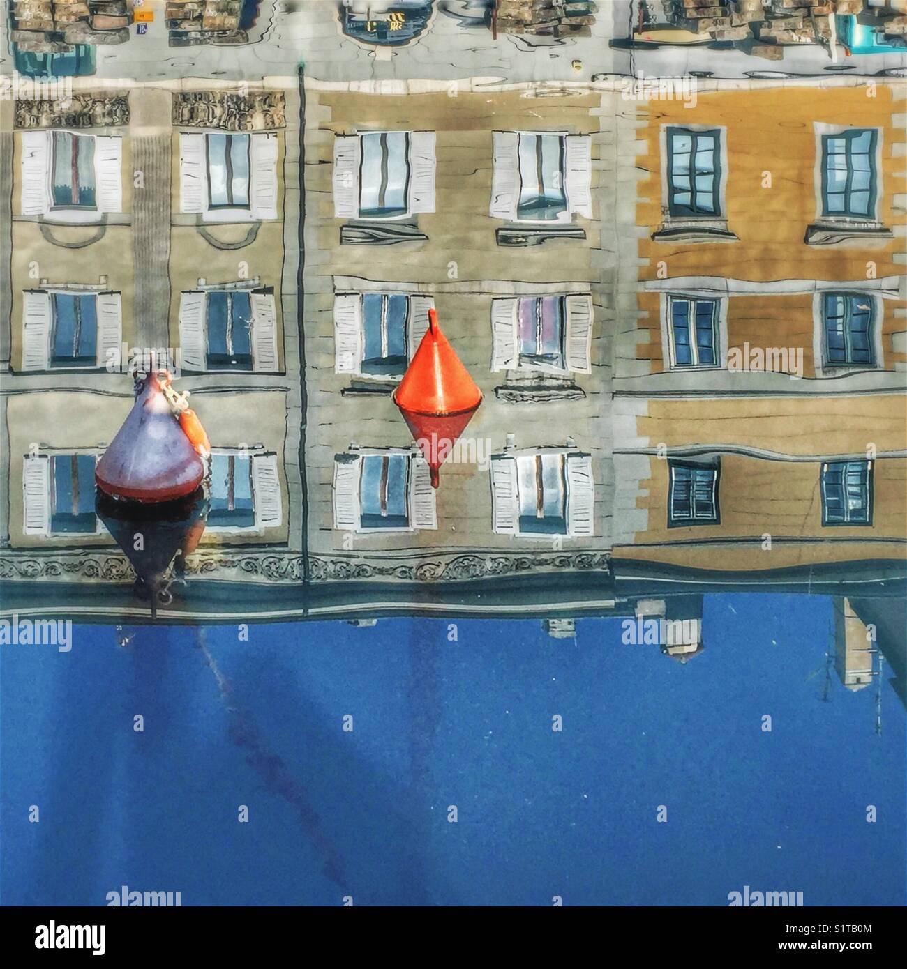 Reflections of houses in water - Canal Grande, Trieste, Italy - Smartphone Captured Stock Image