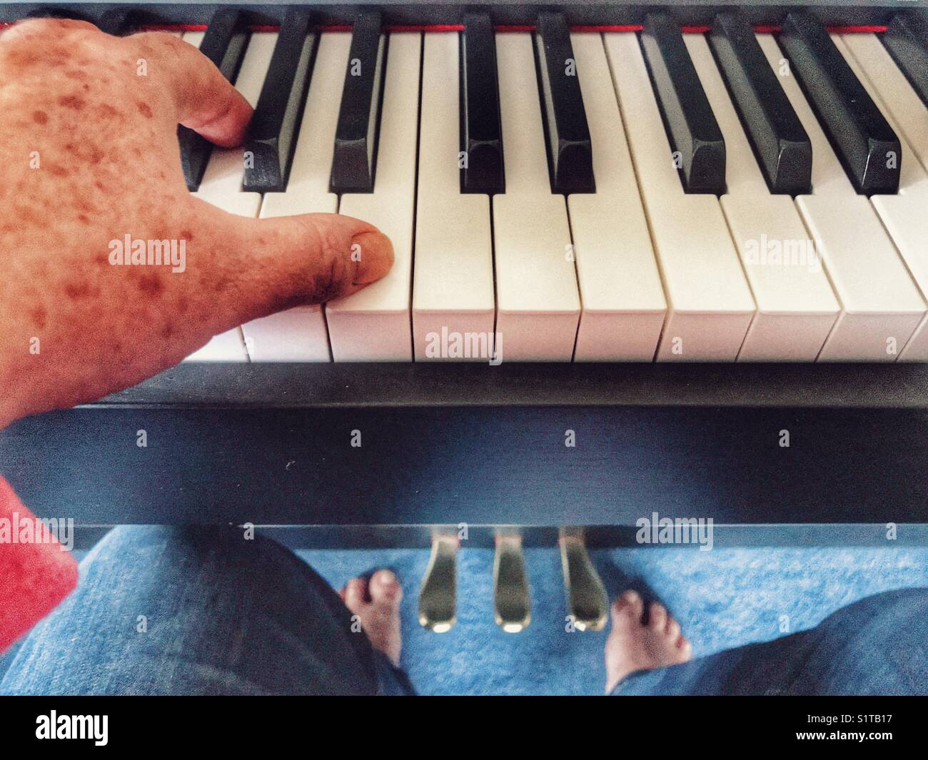 POV sitting at a keyboard - Smartphone Captured Stock Image
