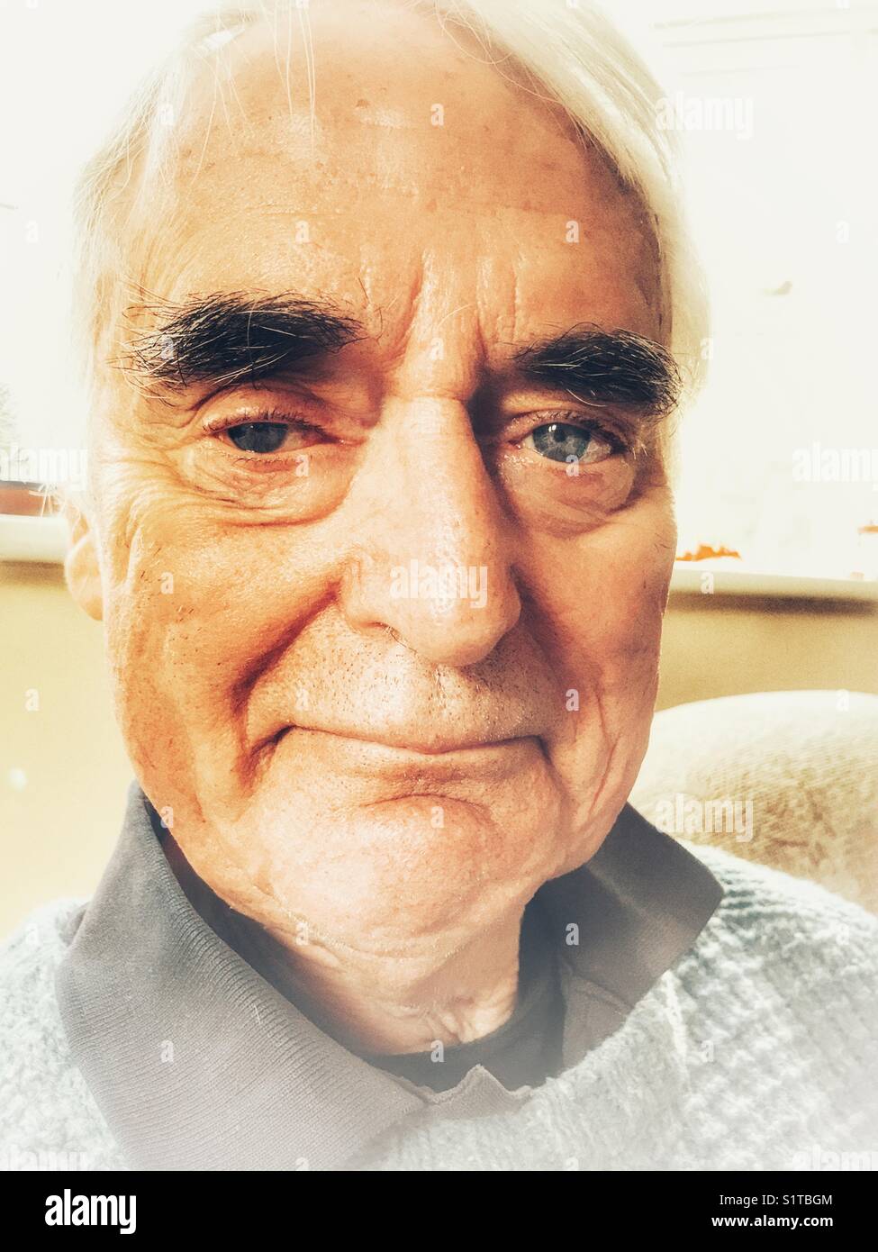 Senior man, H&S portrait, indoors - Smartphone Captured Stock Image