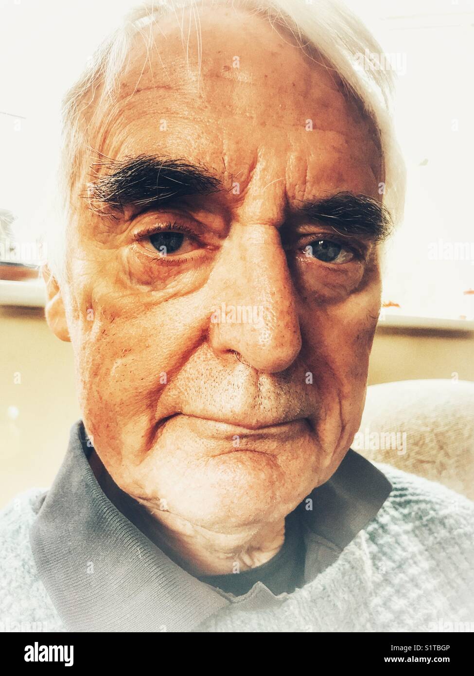 Senior man, H&S portrait, indoors - Smartphone Captured Stock Image