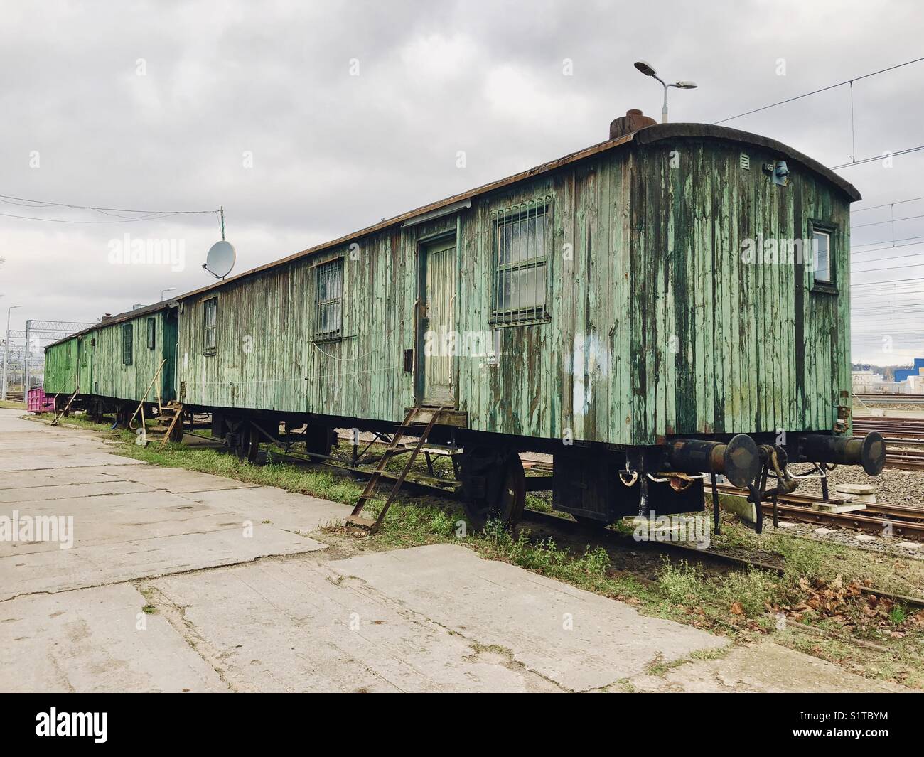 Old train car standing on the side track Stock Photo Alamy