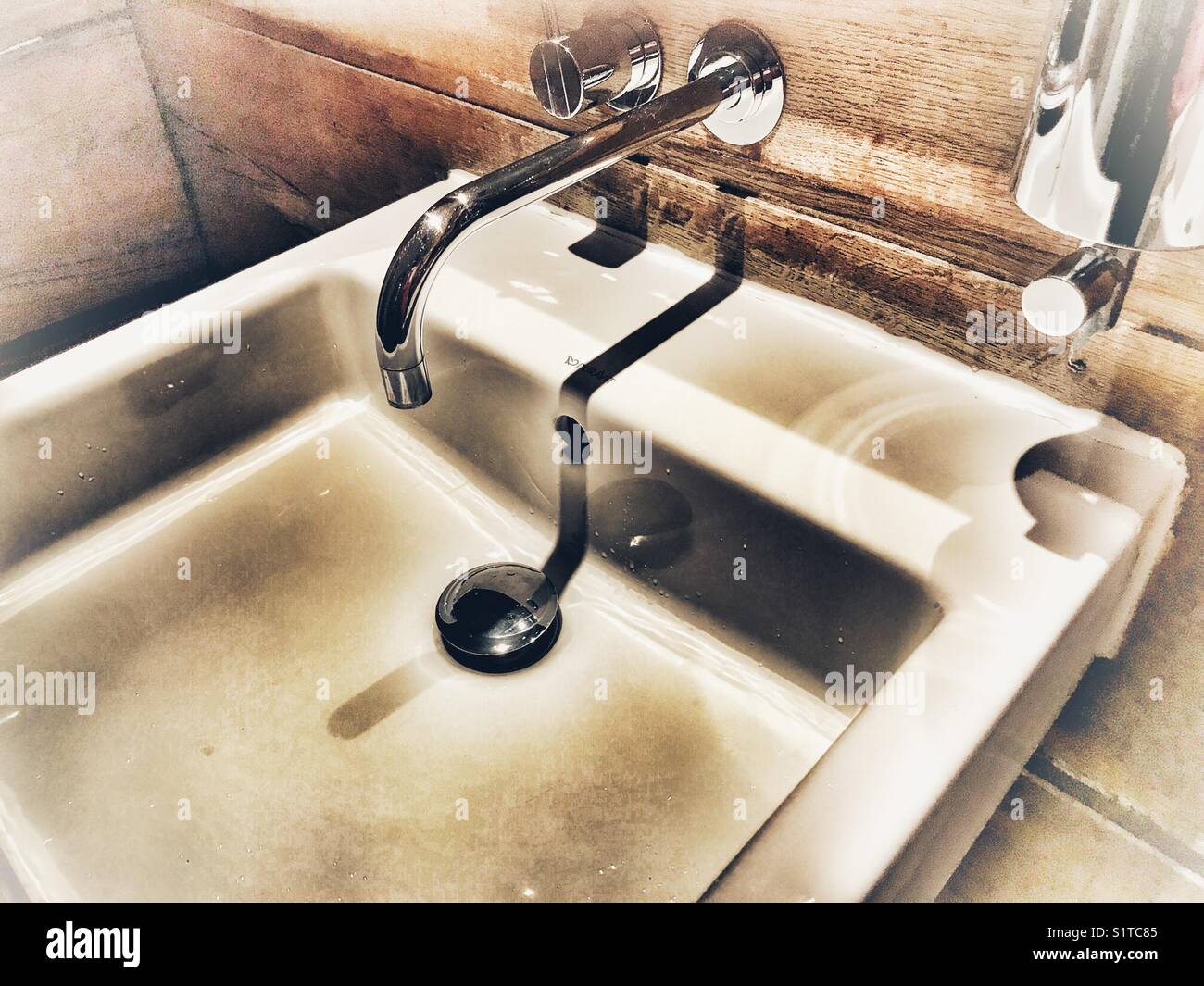 Wash hand basin in a restaurant cloakroom Stock Photo