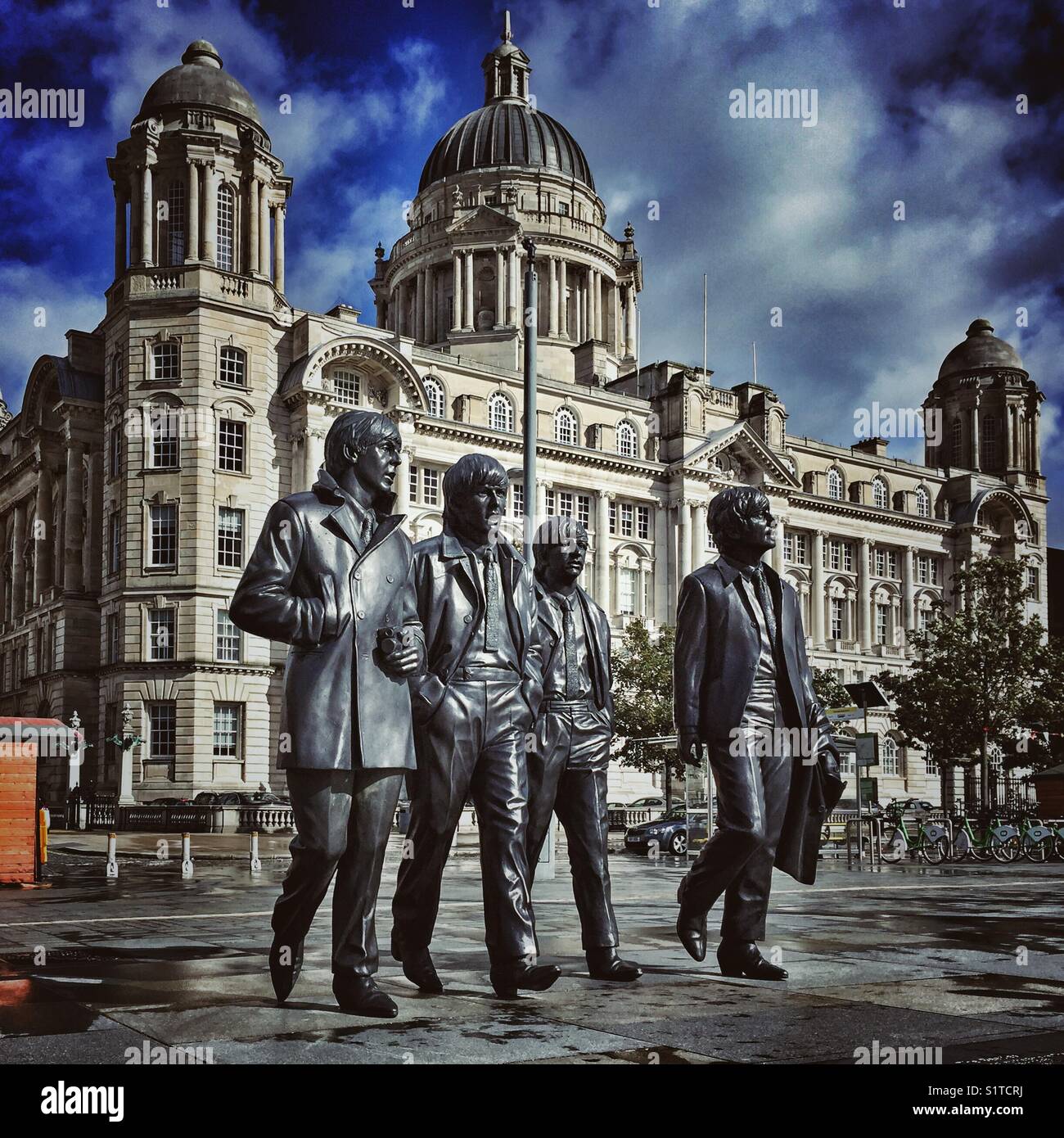 The Beatles statue and the Port of Liverpool building in the background- Liverpool, Merseyside, United Kingdom - Smartphone Captured Stock Image