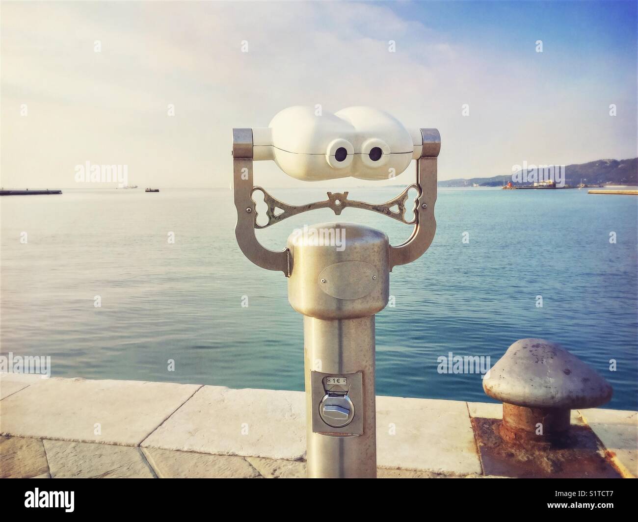 Coin operated binoculars in Trieste harbour - Trieste, Friuli Venezia Giulia, Italy - Smartphone Captured Stock Image