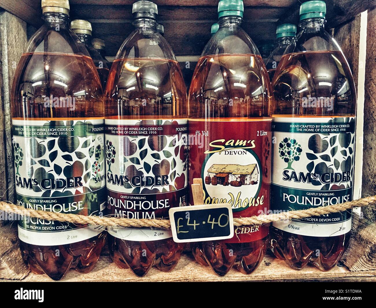 Bottles of Sam’s Cider for sale in a cider factory shop, Winkleigh