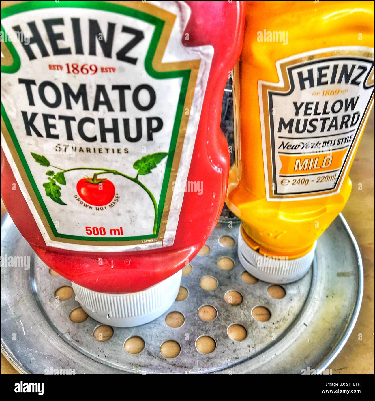 Heinz tomato ketchup and yellow mustard. - Smartphone Captured Stock Image