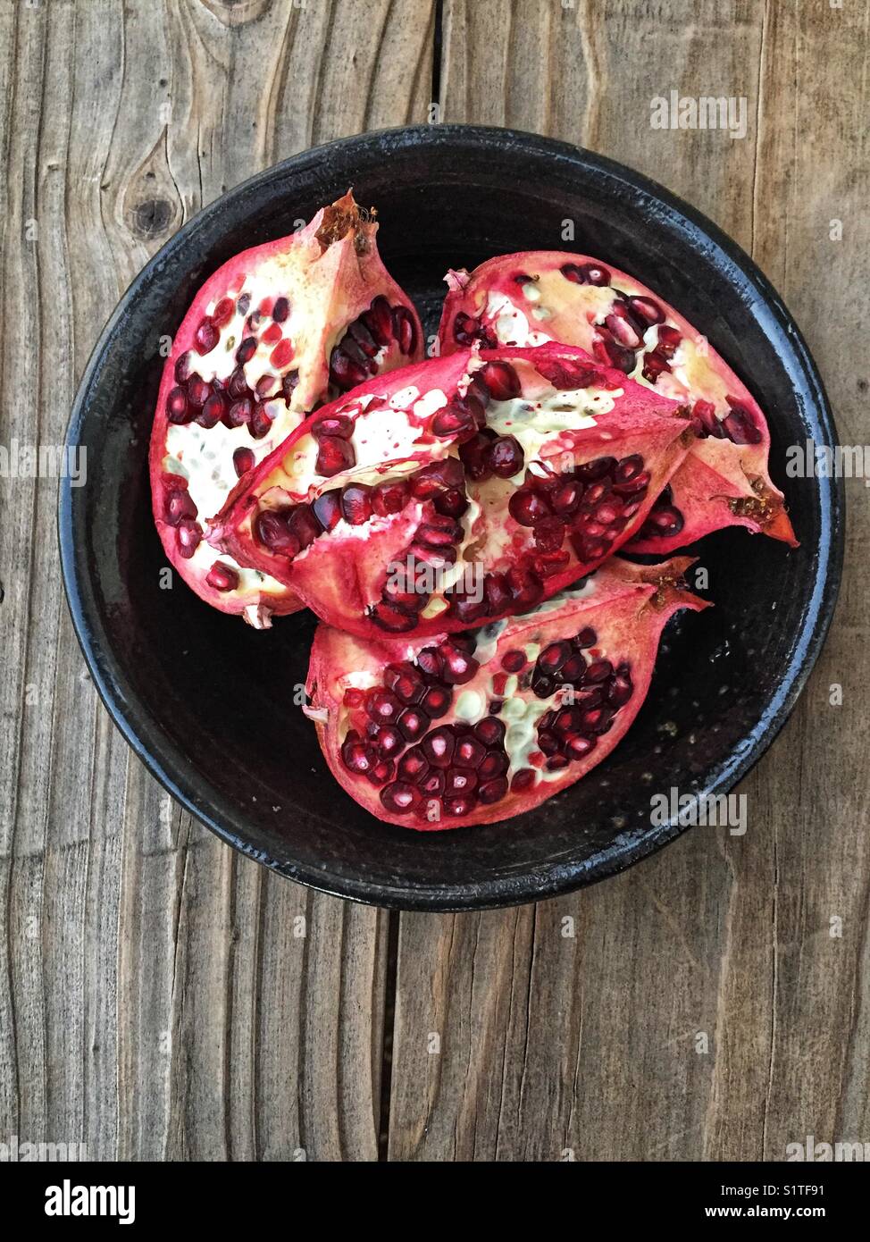 Pomegranate slices in a bowl Stock Photo