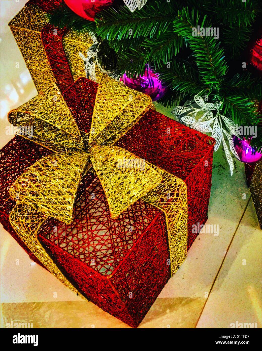 christmas gift near a christmas tree - Smartphone Captured Stock Image
