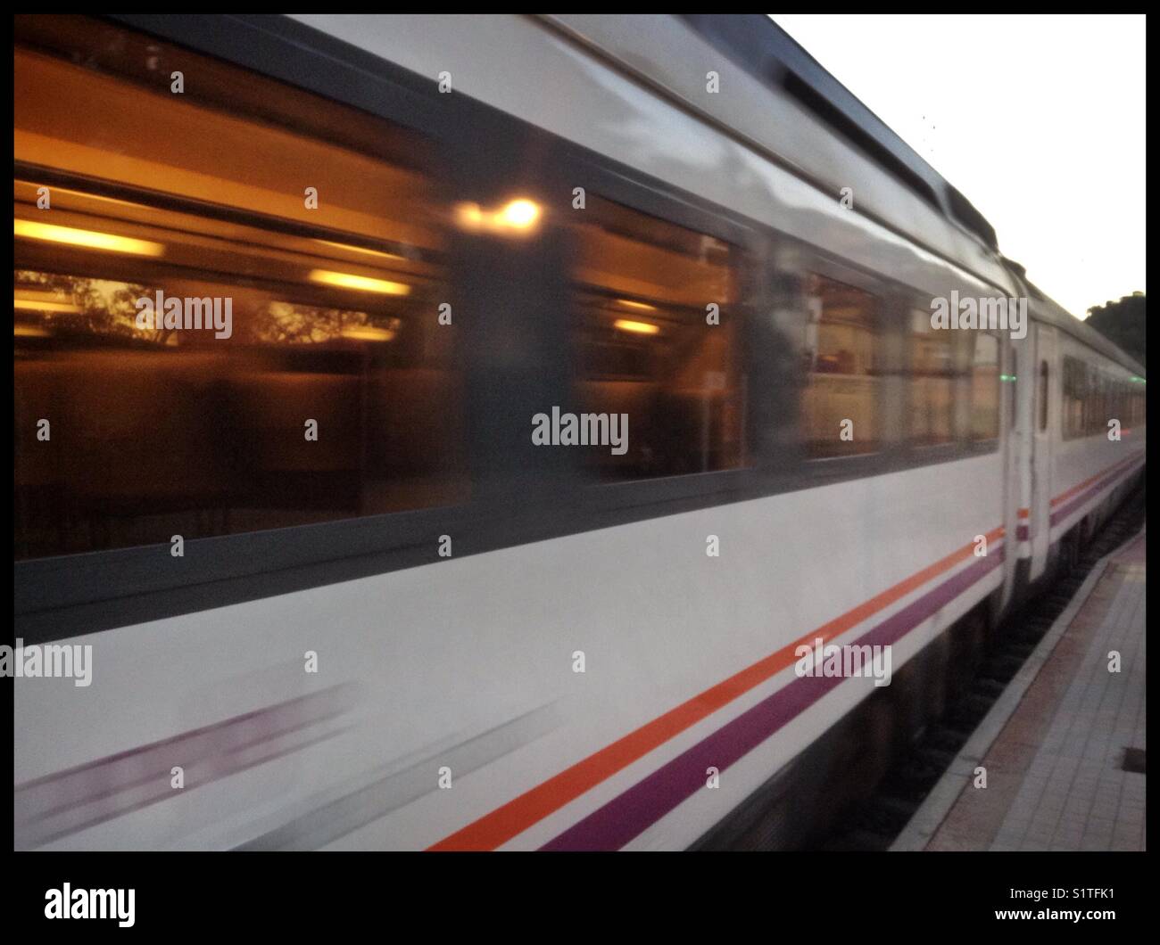 A train leaves the station, Spain. - Smartphone Captured Stock Image