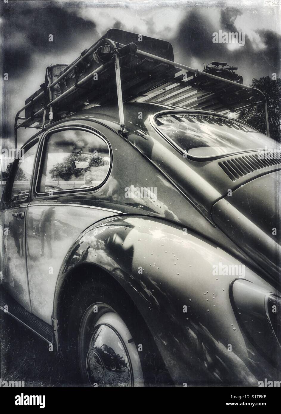 Vintage two-tone Volkswagen Beetle with luggage rack Stock Photo