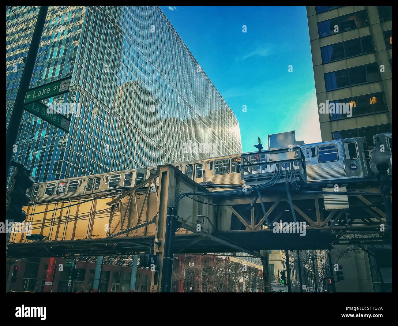 Elevated train travels overhead in Chicago Loop. Stock Photo