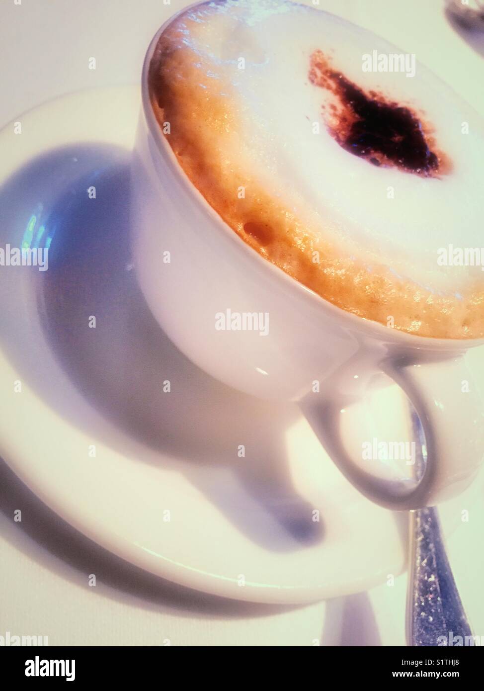 Cappuccino with foam steam milk topping close up - Smartphone Captured Stock Image
