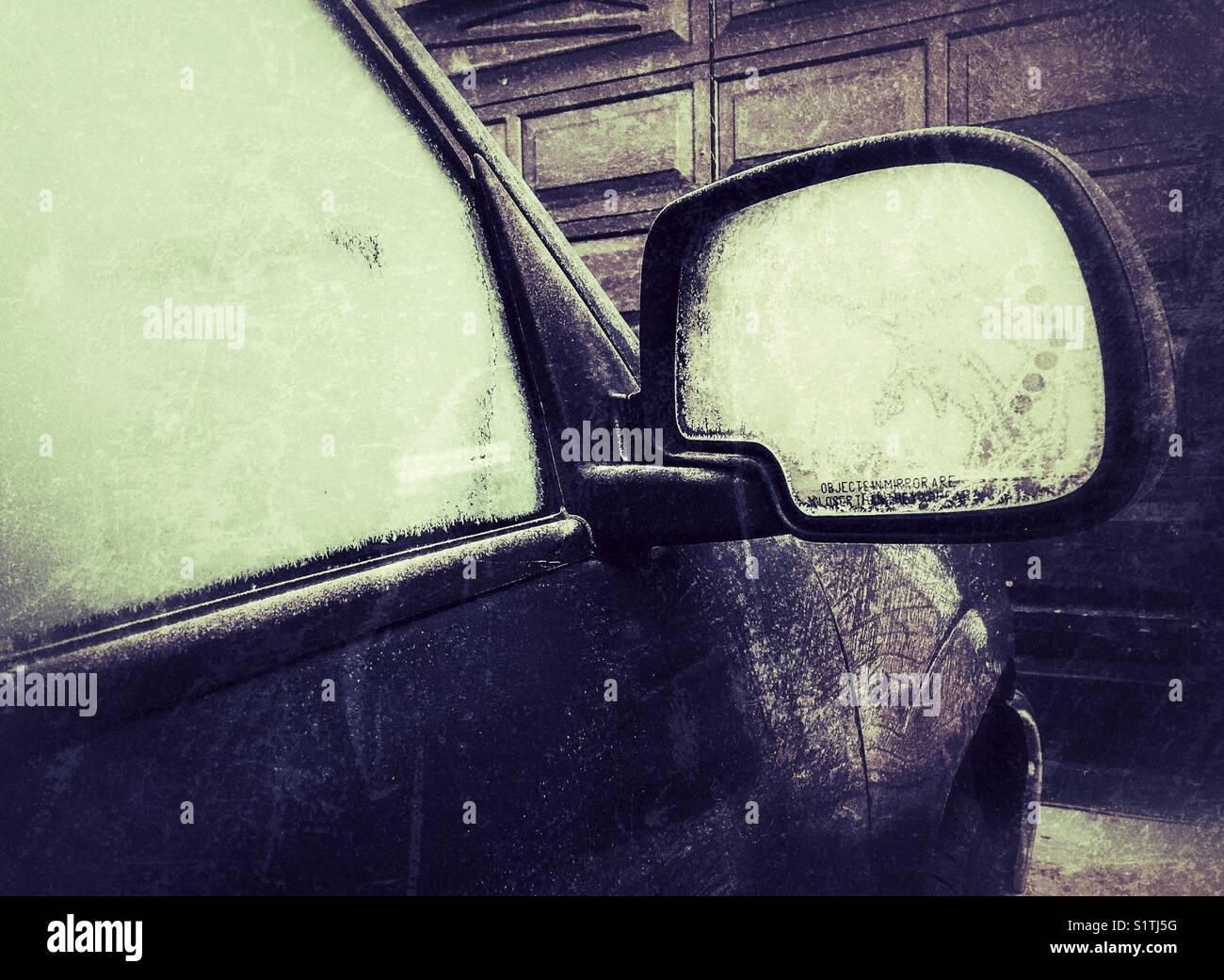 Frosted passenger window and side view mirror early December morning in Ontario, Canada - Smartphone Captured Stock Image