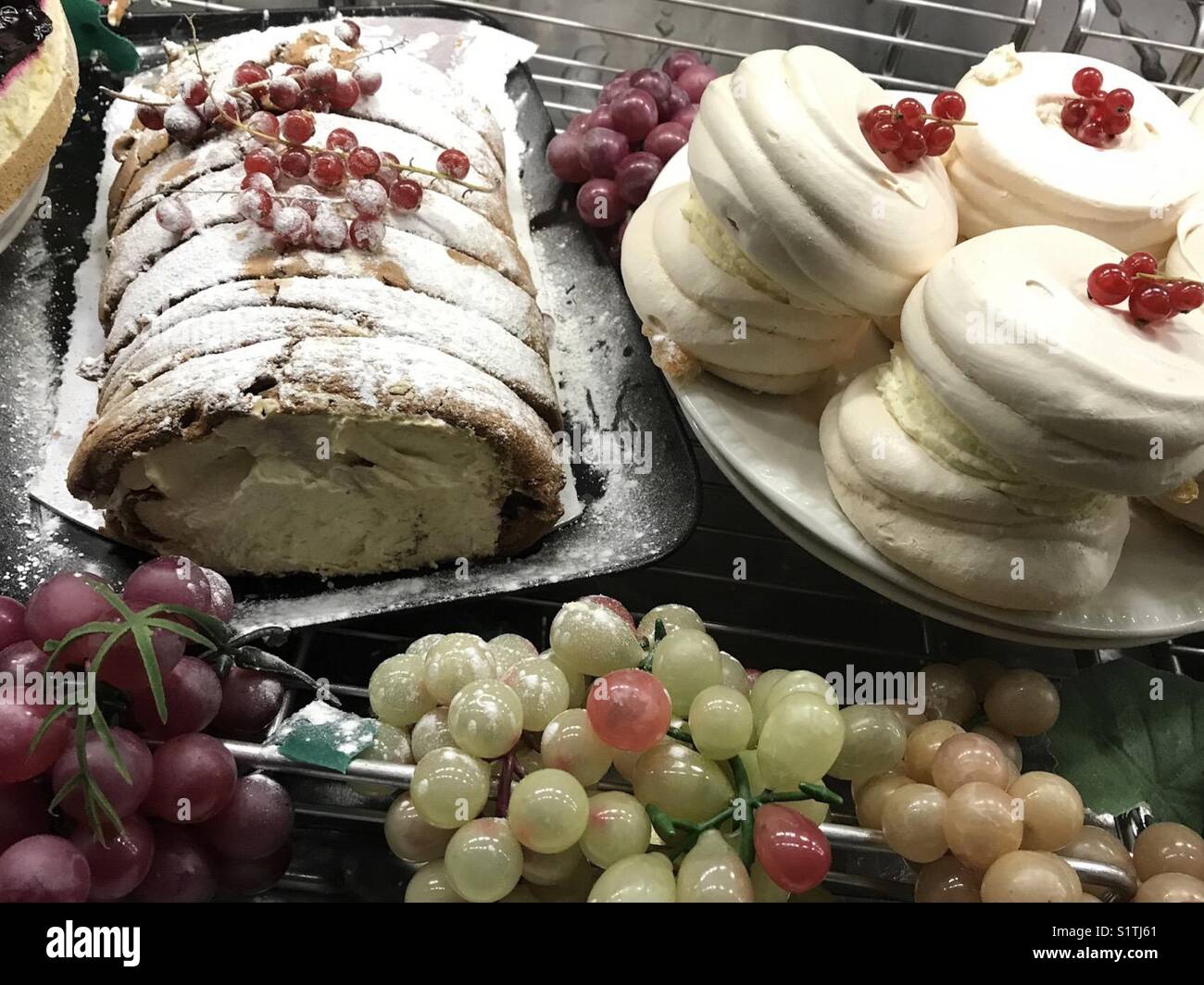Delicious desserts in a display cabinet - Smartphone Captured Stock Image