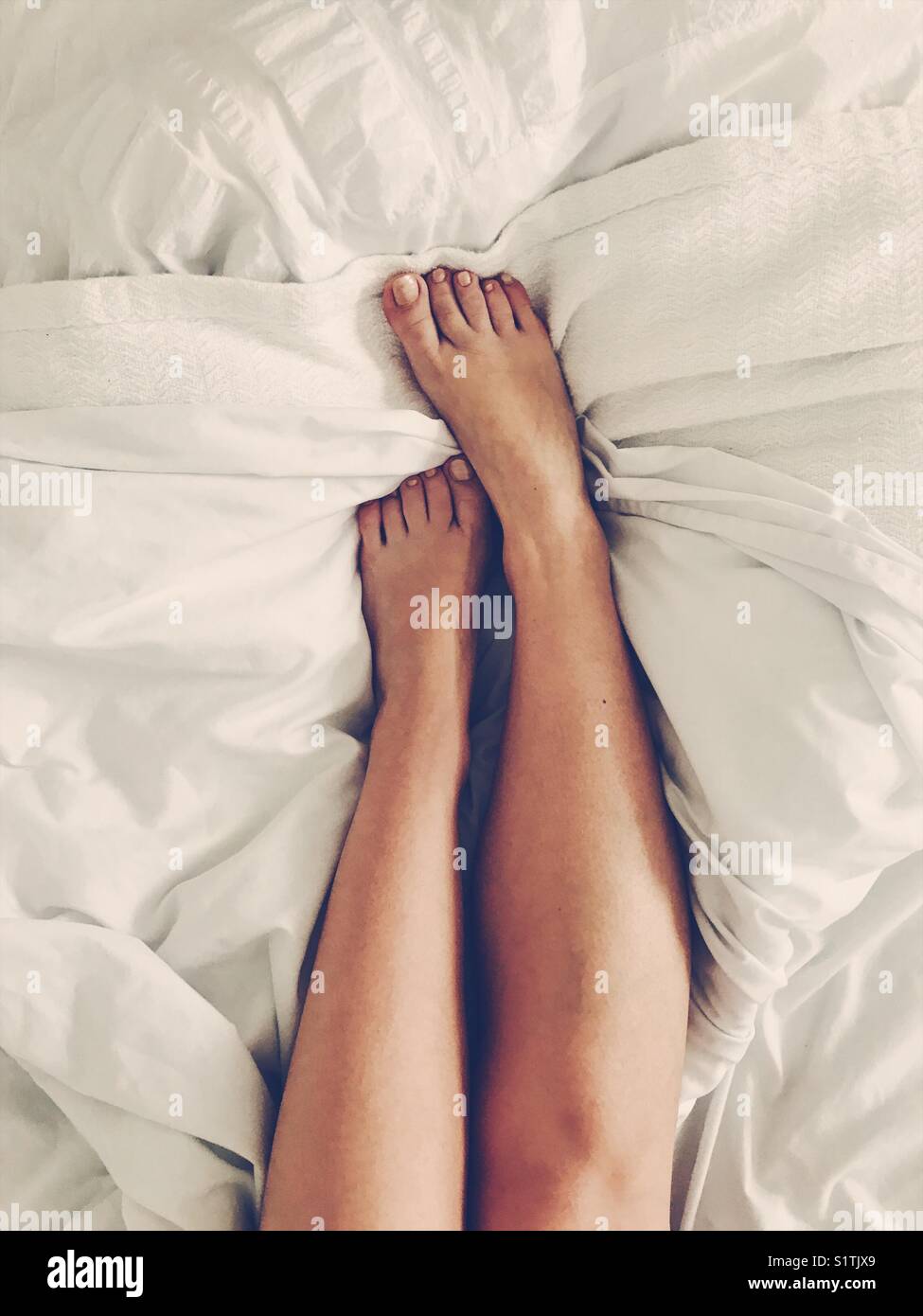 Girl legs bed hires stock photography and images Alamy