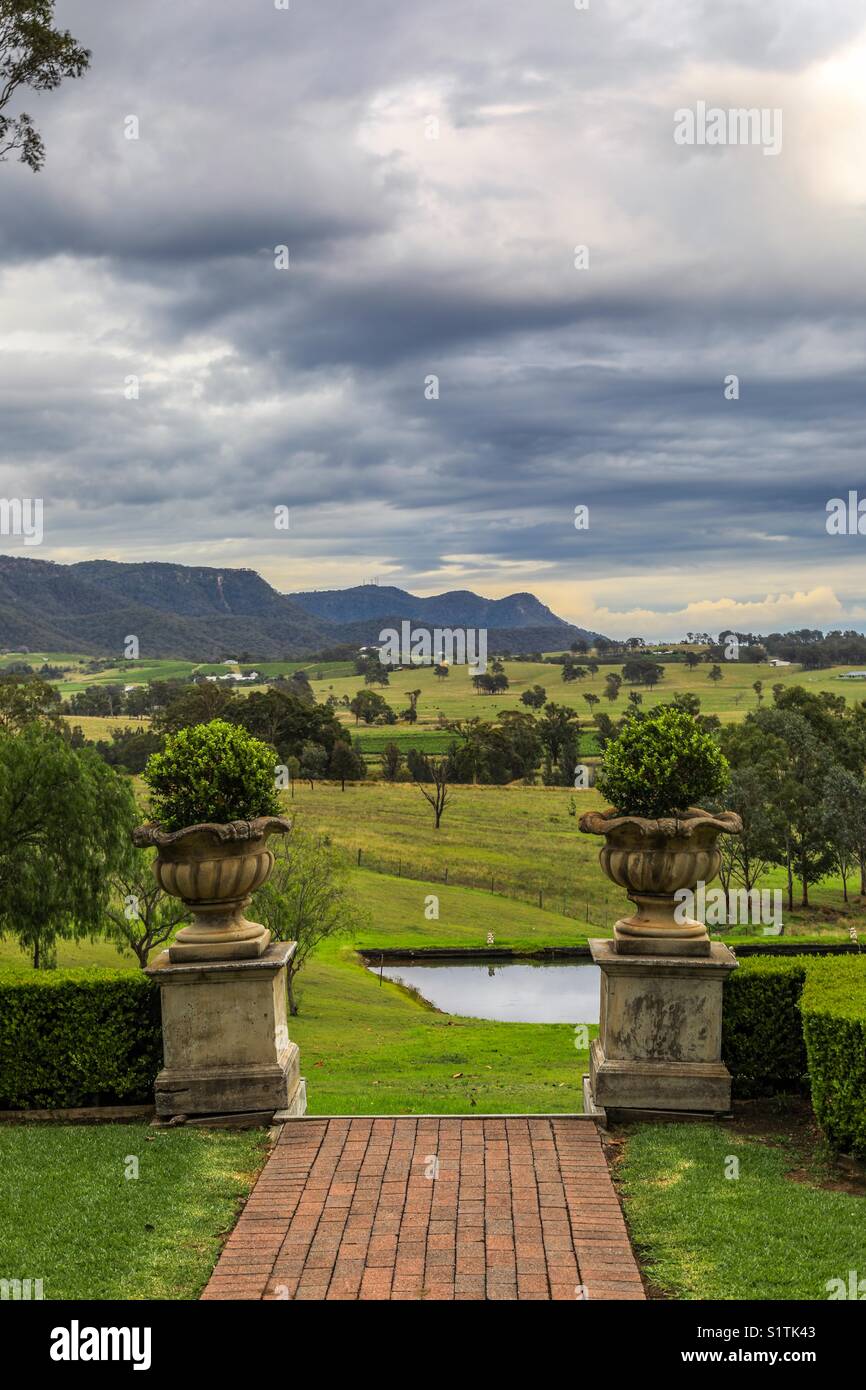 Scenic view of valley and mountain range against cloudy sky - Smartphone Captured Stock Image