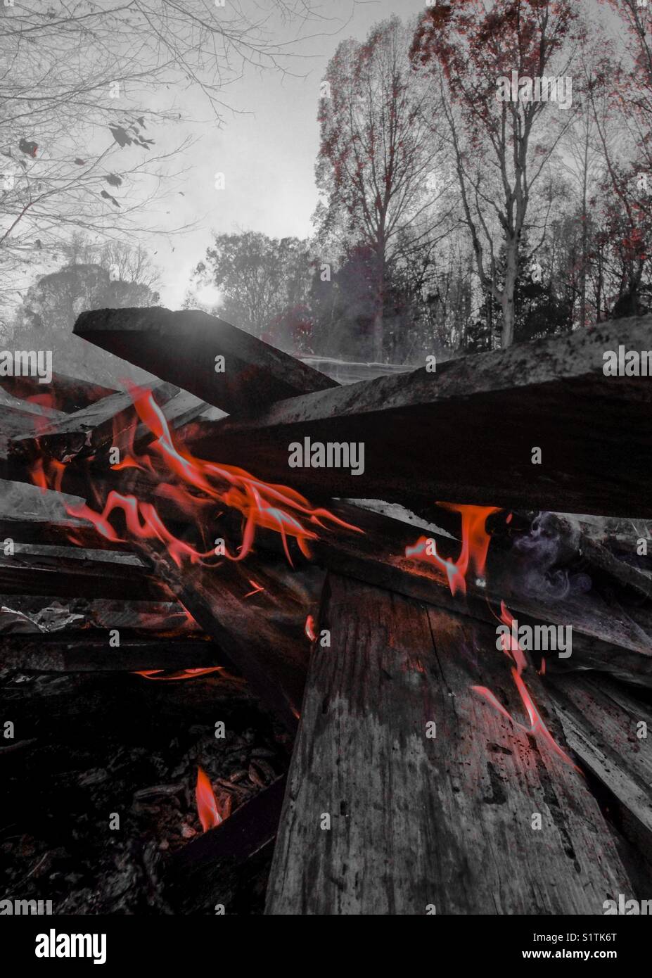 Red color pop of bonfire with wooden planks - Smartphone Captured Stock Image