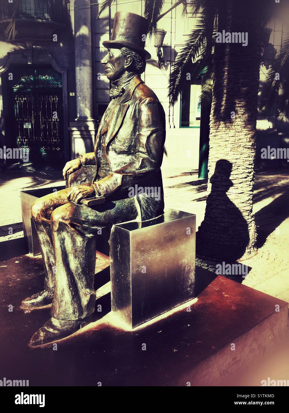 Bronze statue of Hans Christian Andersen in the streets of Malaga, Andalusia, Spain - Smartphone Captured Stock Image