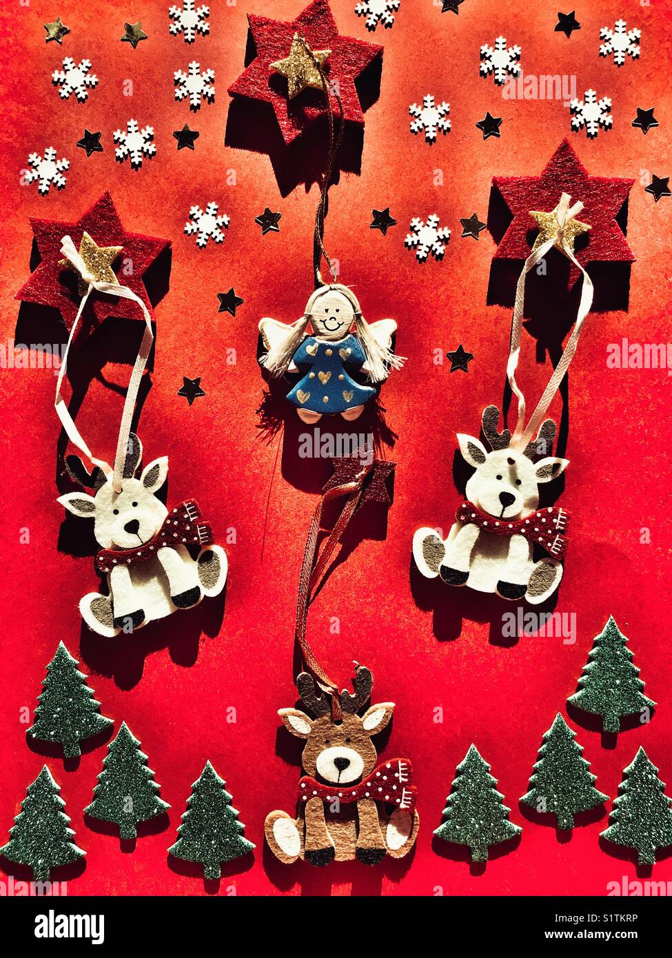 Christmas themed flatlay photography, red background - Smartphone Captured Stock Image