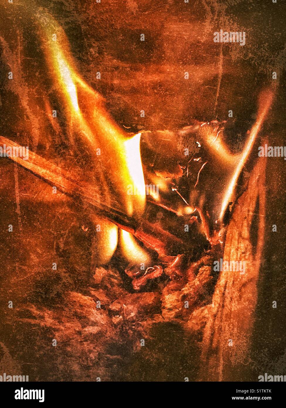 Closeup of wood burning in a wood stove - Smartphone Captured Stock Image